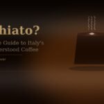 **macchiato coffee cup with espresso and milk foam on dark background**