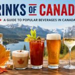 Drinks of Canada featured image showing coffee, maple syrup, Caesar cocktail, beer, ice wine, maple water, and berry juice displayed on a wooden table with a Canadian flag and mountain lake background.